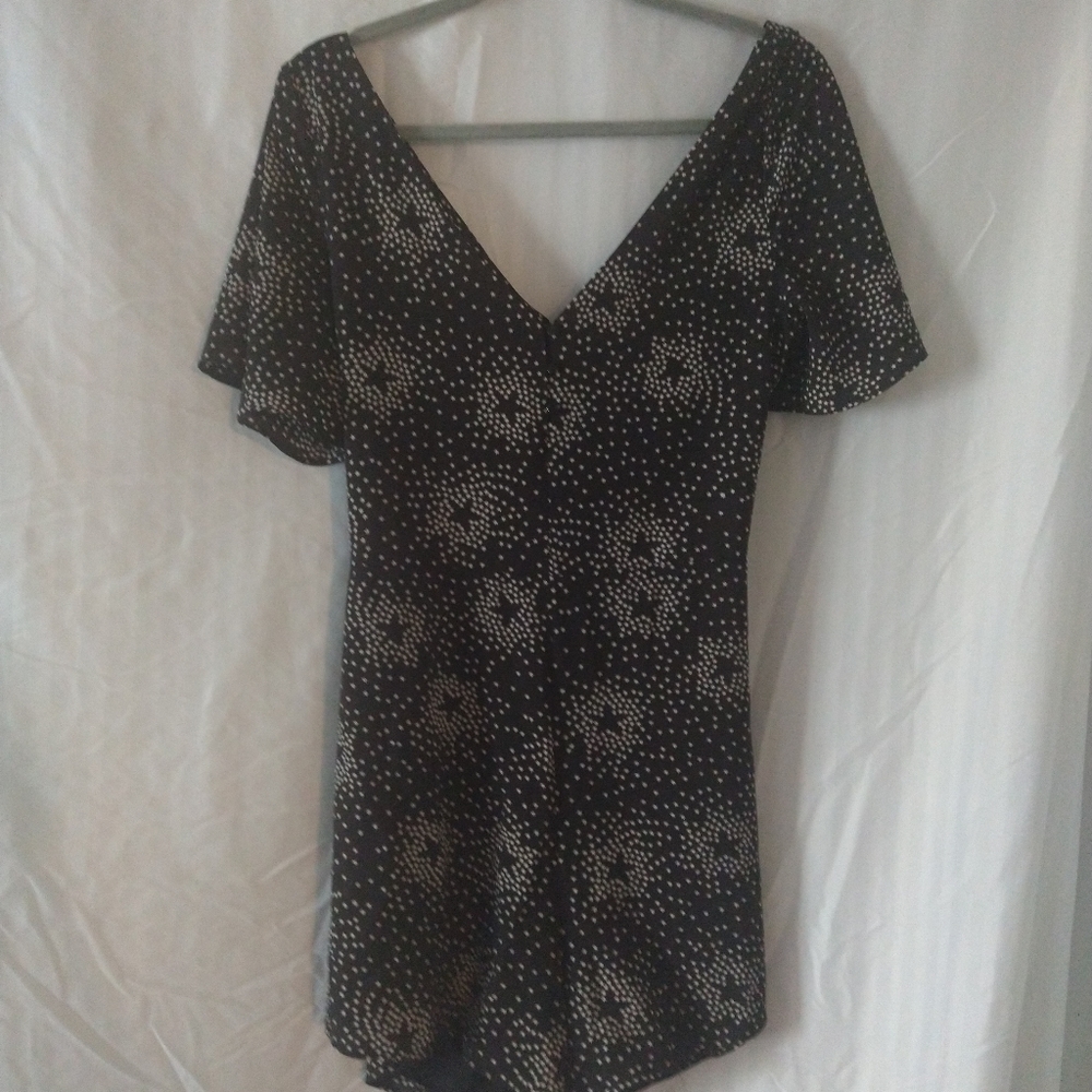 Black and white short romper with open back